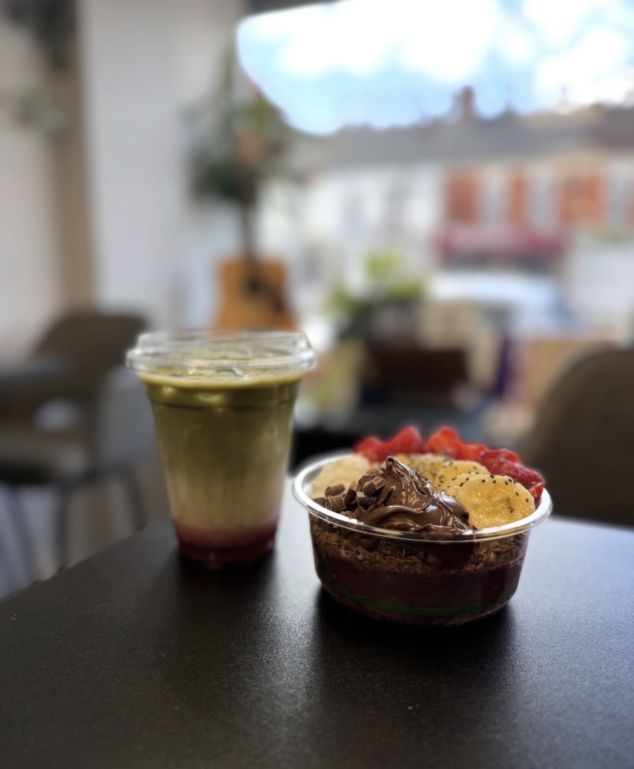 An iced matcha and a fruit-topped bowl at Create Coffee